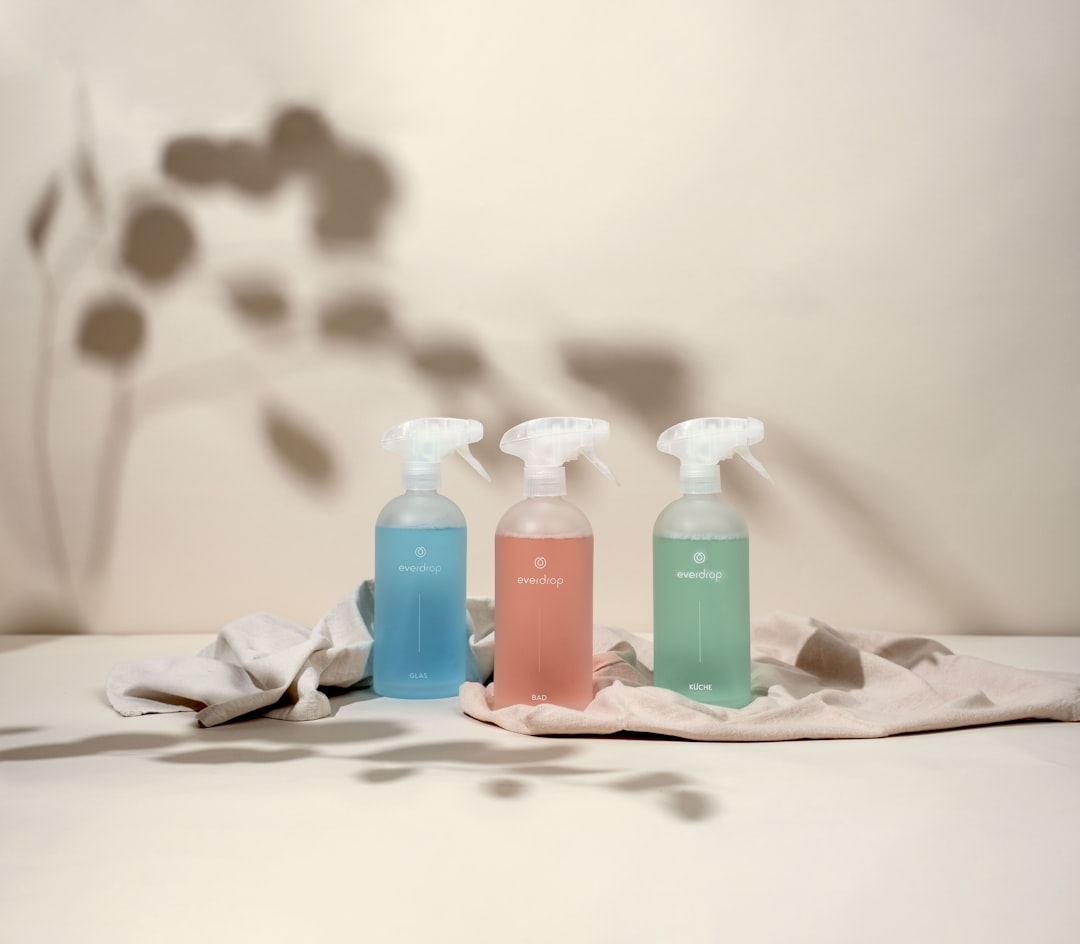 three-bottles-of-hand-sanitizers-sitting-on-a-table-vkdycl9y93a